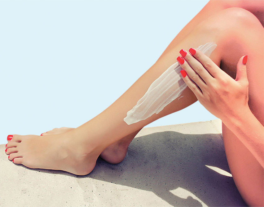 Woman apply cream on her smooth tanned legs - Wedding Affair