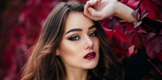 Makeup Inspirations For A Winter Wedding 2023 The beautiful girl stands near walll with leaves-WeddingAffair
