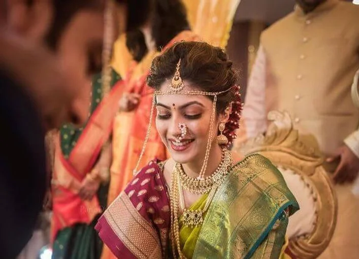  A traditional Marathi bride styles her Paithani saree