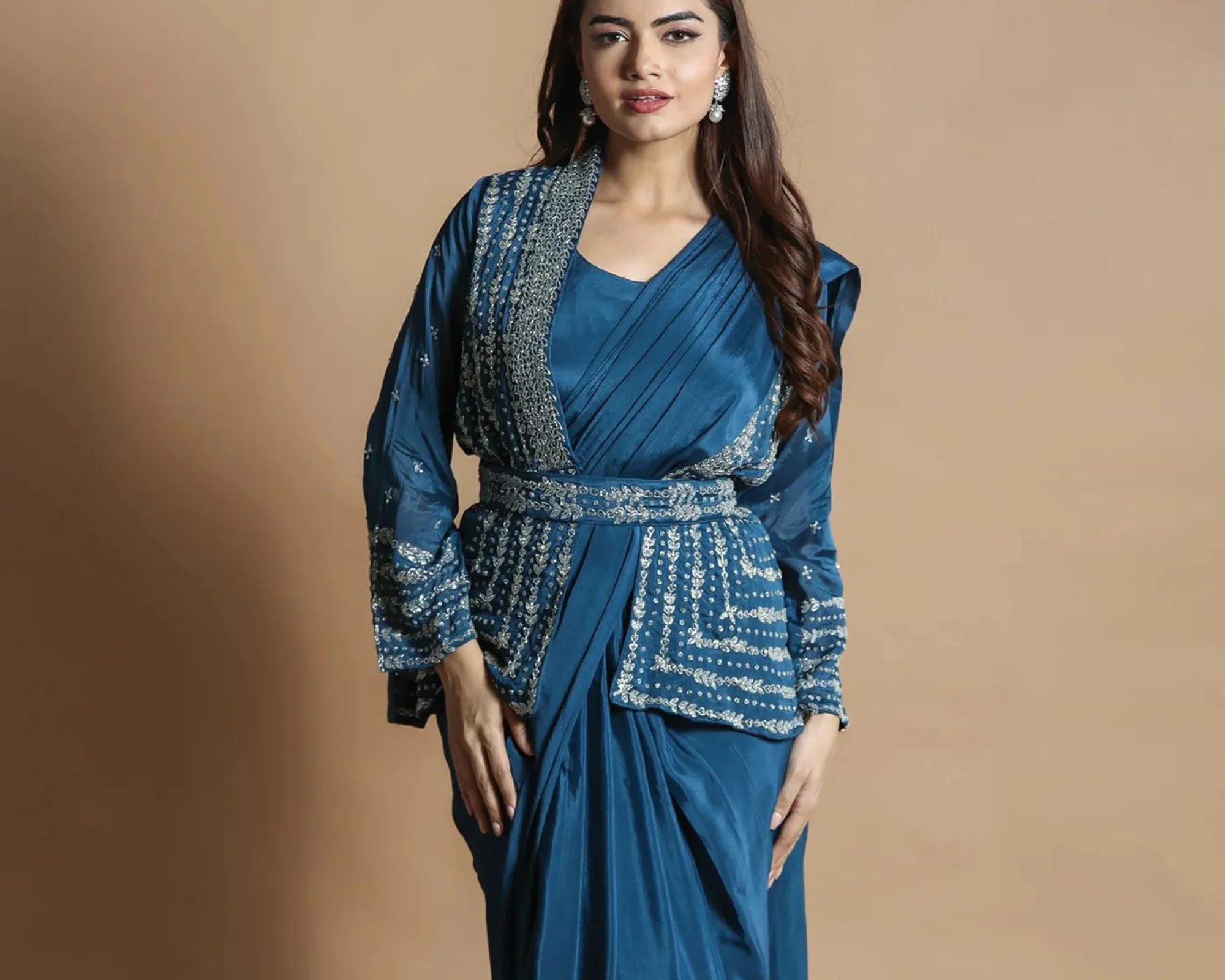 Teal Blue Chinnon gown, featuring intricate embroidered patterns and a flowy silhouette to ooze ultimate confidence in Navratri celebrations.